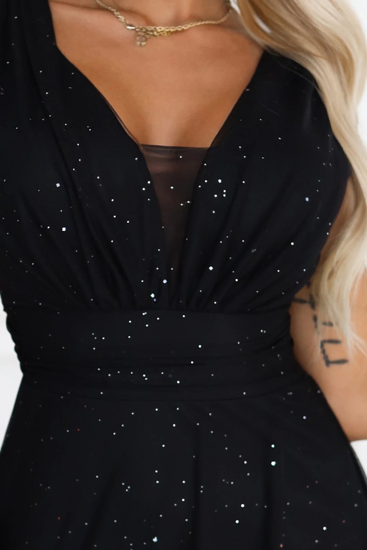 Long evening dress with a glitter accent and a deep neckline – Black