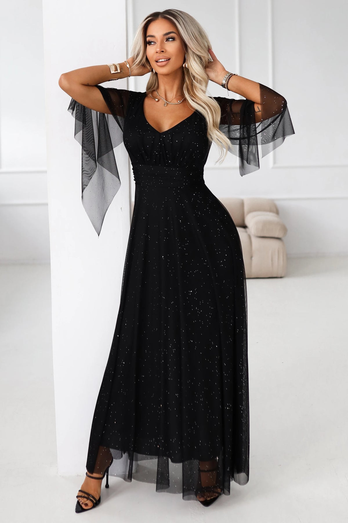Long, shimmering dress with a neckline and transparent sleeves – Black