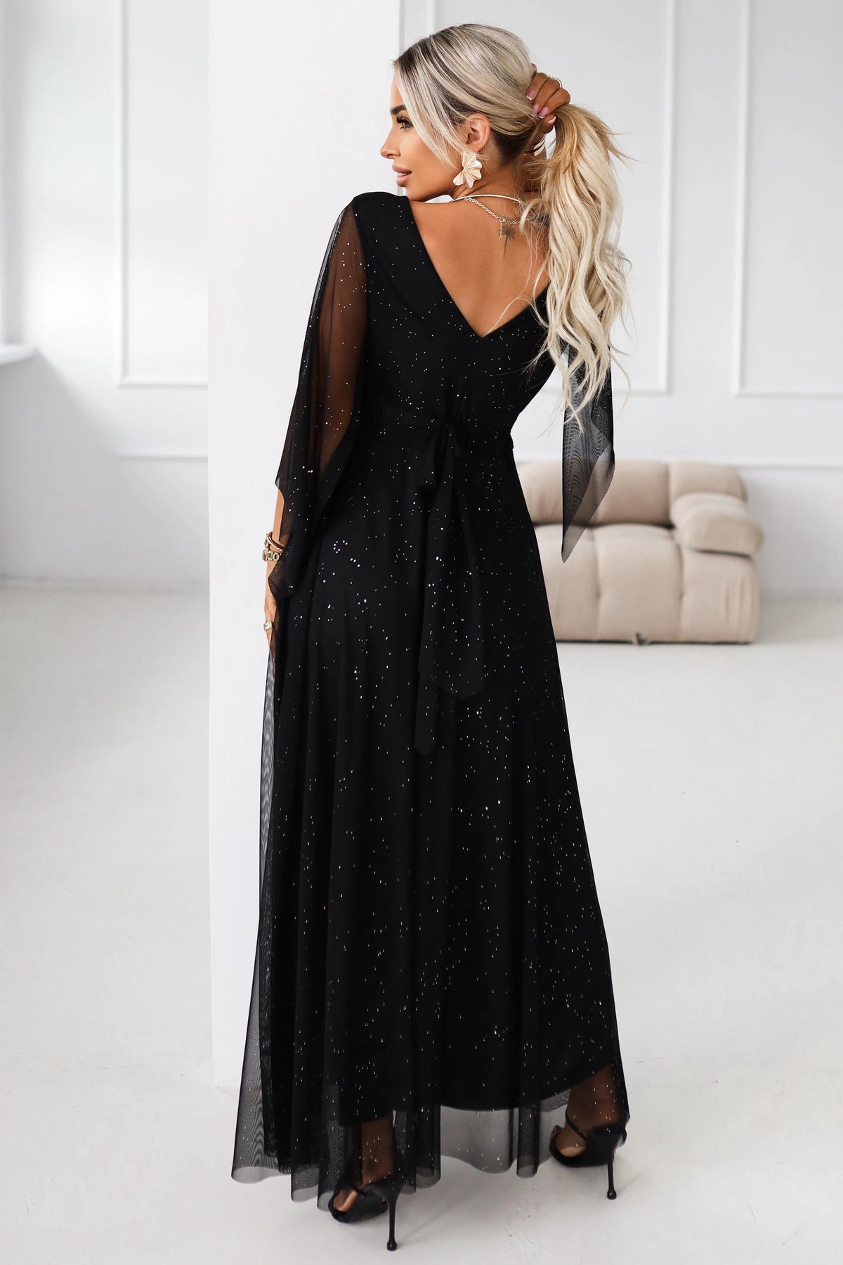 Long, shimmering dress with a neckline and transparent sleeves – Black