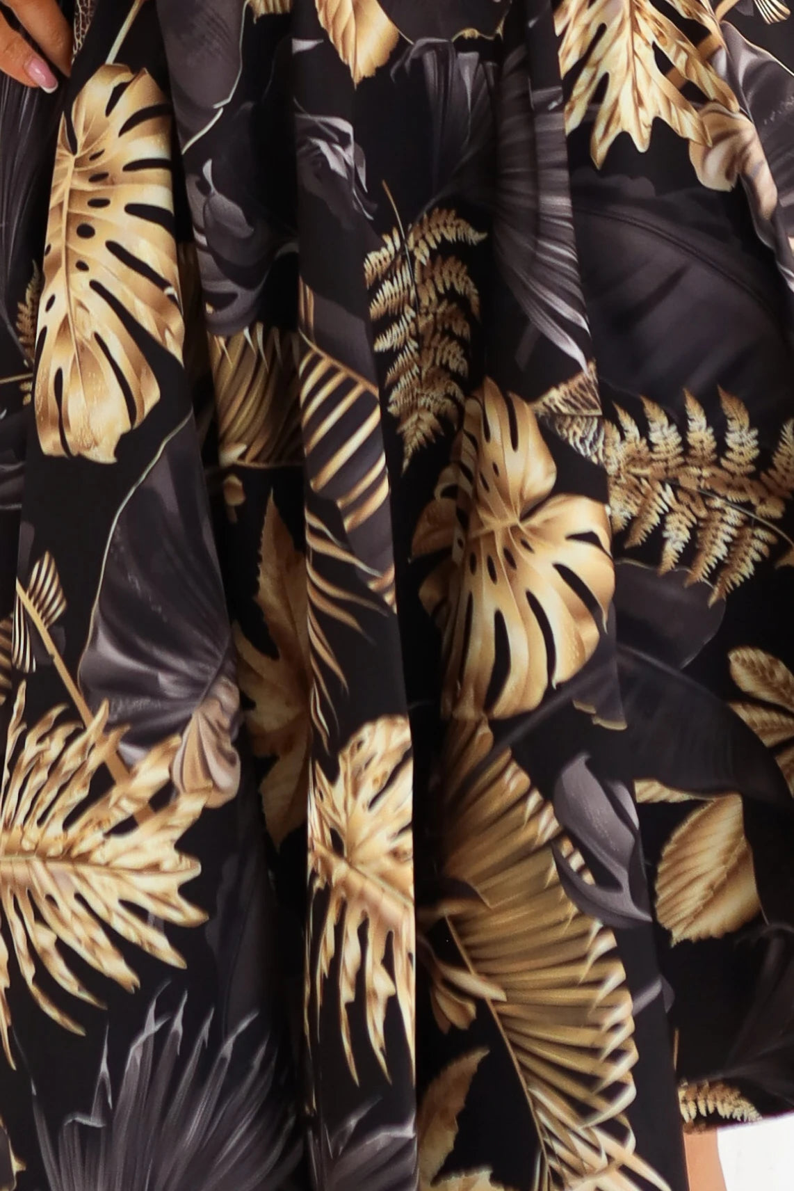 Black midi dress with an elegant top and flared bottom – Golden Leaves