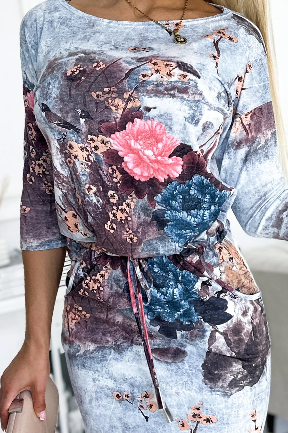 Sports dress with a tie – Flowers On A Stone Background
