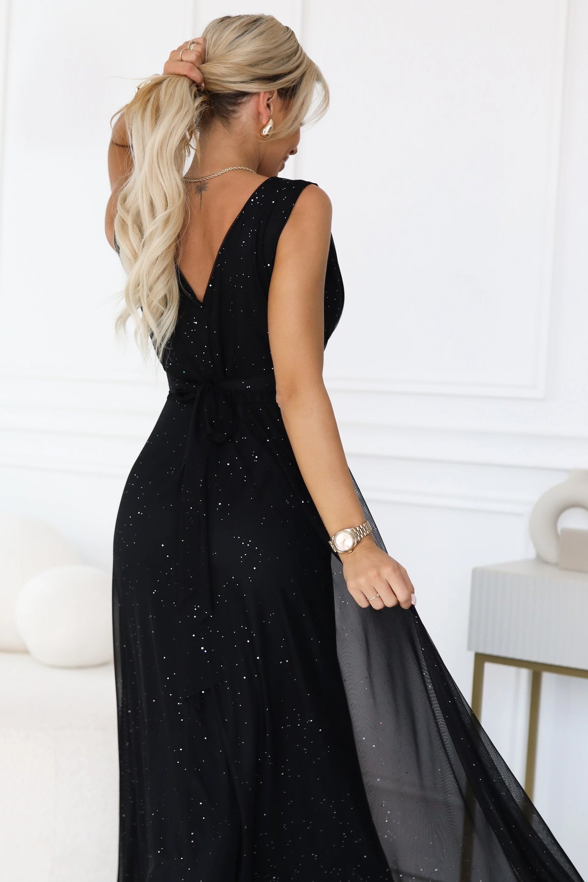 Long evening dress with a glitter accent and a deep neckline – Black