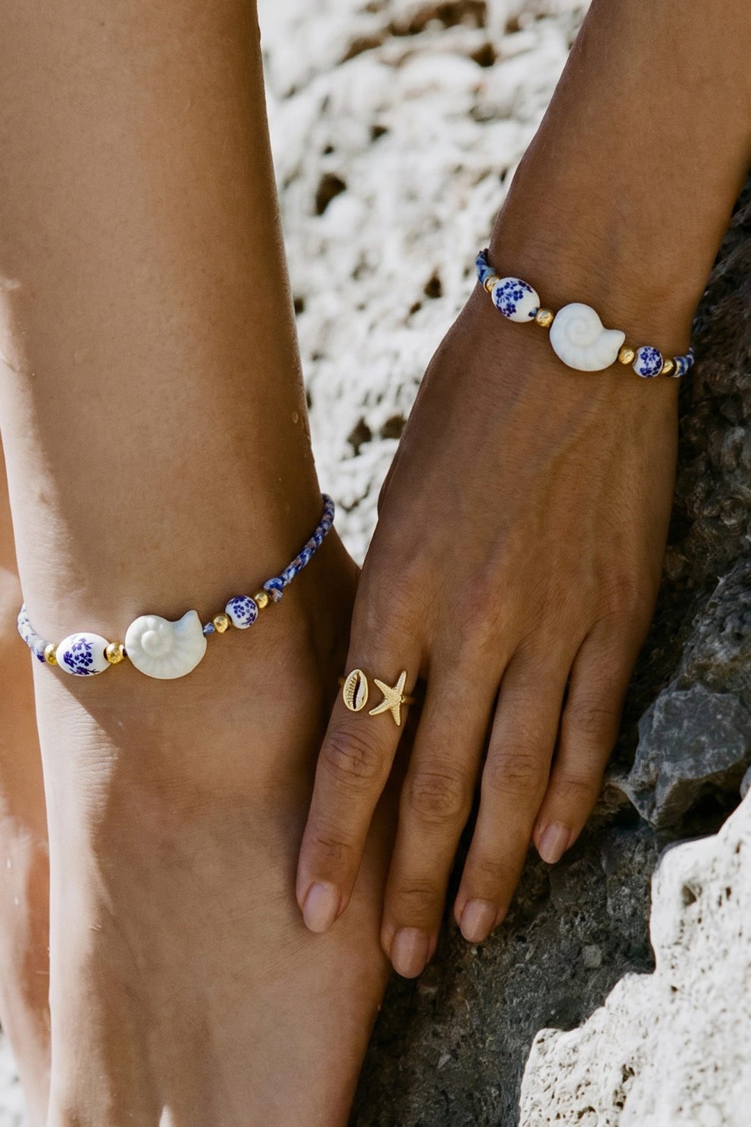 Rope bracelet with shell and floral design beads
